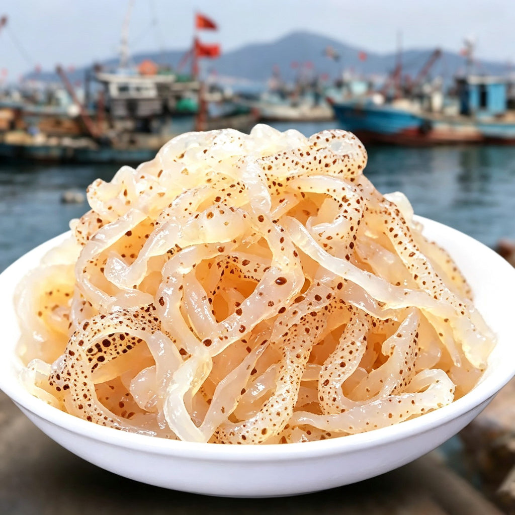 Bowl of translucent salted jellyfish strips with the harbour behind