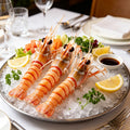 Raw scampi on crushed ice with a soy dipping sauce